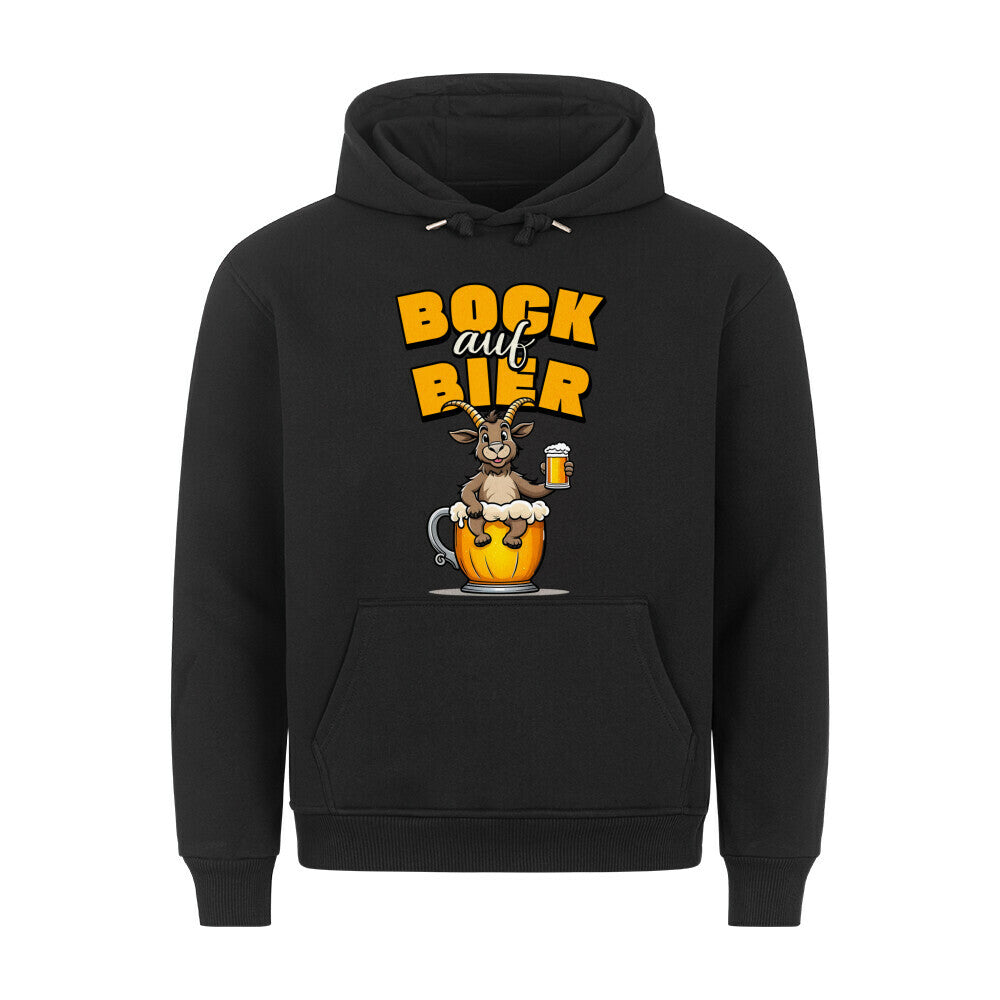 Schwarzer Hoodie. Auf der Vorderseite ist ein stilisierter, brauner Ziegenbock mit einem gelben Bierkrug in der Hand abgebildet. Der Bock sitzt in einer großen, goldenen Bierkrug-Silhouette. Über dem Bock steht der Schriftzug "BOCK auf BIER", wobei "BOCK" und "BIER" in gelber Farbe und "auf" in weißer Farbe dargestellt ist.