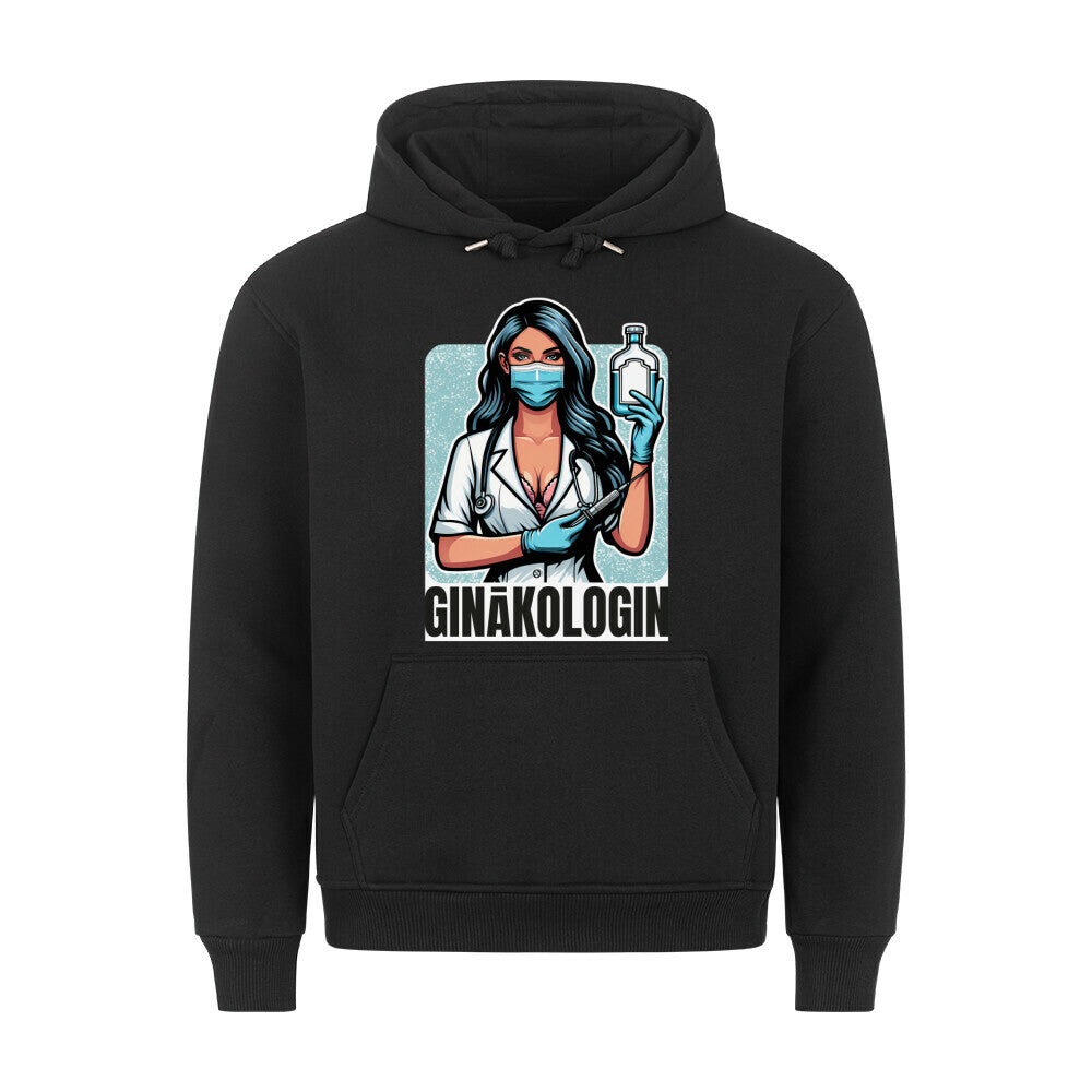 Schwarzer Hoodie. Auf der Vorderseite ist eine stilisierte, comicartige Illustration einer Ärztin mit langem, dunklem Haar, einer medizinischen Maske und einem Stethoskop. Sie hält eine Spritze und eine Flasche in den Händen. Unter der Illustration steht der Text "GINÄKOLOGIN" in weißen Buchstaben.